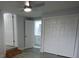 Bedroom including an ensuite bathroom and closet with wood-look flooring at 8405 N Willow Ave, Tampa, FL 33604