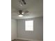 Bedroom featuring a ceiling fan and a window with blinds at 8405 N Willow Ave, Tampa, FL 33604