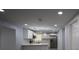 Bright, open kitchen with stainless steel appliances and modern white cabinetry at 8405 N Willow Ave, Tampa, FL 33604