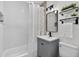 Bathroom featuring subway tile, modern fixtures, and a tub with shower at 8939 90Th Ave, Seminole, FL 33777
