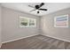 Bright bedroom features carpet floors, two windows, and ceiling fan at 8939 90Th Ave, Seminole, FL 33777