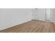 Spacious bedroom with wood-look flooring and multiple closets at 8939 90Th Ave, Seminole, FL 33777