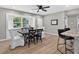 Bright dining area features stylish chairs, a view to the outside and seamless flow to the kitchen at 8939 90Th Ave, Seminole, FL 33777