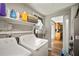 Functional laundry room with direct access to kitchen at 903 Dixie Maid Ln, Valrico, FL 33594