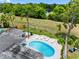 Aerial view of a landscaped backyard with a kidney-shaped pool and plenty of green space at 9109 134Th Way, Seminole, FL 33776