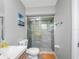 Bathroom featuring a glass shower, neutral walls and white fixtures at 9109 134Th Way, Seminole, FL 33776