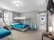 Bedroom featuring bunk beds, a mounted TV, and access to another room at 9109 134Th Way, Seminole, FL 33776