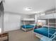 Spacious bedroom featuring bunk beds, a mounted TV, and a large closet at 9109 134Th Way, Seminole, FL 33776