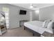 Bedroom featuring a ceiling fan, TV, and a large bed with white linens at 9109 134Th Way, Seminole, FL 33776