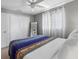 Bedroom featuring a large closet, a ceiling fan, and a large mirror at 9109 134Th Way, Seminole, FL 33776