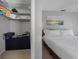 Bedroom featuring a closet and a bed with white linens and a soft textured headboard at 9109 134Th Way, Seminole, FL 33776