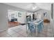 Bright dining area boasts tile flooring and access to the patio and kitchen at 9109 134Th Way, Seminole, FL 33776