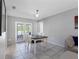 Dining room with view of the porch and a table with seating for four at 9109 134Th Way, Seminole, FL 33776