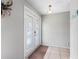 Front entryway with decorative glass doors and neutral decor at 9109 134Th Way, Seminole, FL 33776
