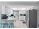 Updated kitchen with white cabinets, stainless steel appliances, tile floors and a nice backsplash at 9109 134Th Way, Seminole, FL 33776