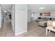 Open layout showcases a living room with tile flooring, access to dining area at 9109 134Th Way, Seminole, FL 33776