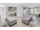Spacious living room featuring tile floors, neutral furniture, and access to other living areas at 9109 134Th Way, Seminole, FL 33776