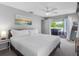 Main bedroom has carpet floors, ceiling fan and access to back porch with hot tub at 9109 134Th Way, Seminole, FL 33776