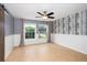 Bright bedroom featuring two windows and tile flooring at 932 Woodbridge Ct, Safety Harbor, FL 34695