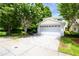 Two-story home with an attached two-car garage and paver driveway at 932 Woodbridge Ct, Safety Harbor, FL 34695