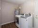 Functional laundry room equipped with a modern washer and dryer, providing convenience and efficiency at 932 Woodbridge Ct, Safety Harbor, FL 34695