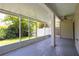 Screened-in patio offering a view of the yard and backyard privacy fence at 932 Woodbridge Ct, Safety Harbor, FL 34695