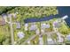 Aerial view of neighborhood featuring a swimming pool, water access and well-maintained lawns at 105 E North Branch Rd, Ruskin, FL 33570