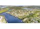 Wide aerial perspective highlighting the waterfront community, serene waterways, and lush surroundings at 105 E North Branch Rd, Ruskin, FL 33570