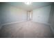 A spacious bedroom featuring new carpet and a large double door closet at 105 E North Branch Rd, Ruskin, FL 33570