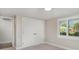 Bright bedroom with plush new carpet, a window with shutters and a closet at 105 E North Branch Rd, Ruskin, FL 33570