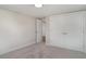 This bedroom features neutral walls, gray carpet, and a large closet at 105 E North Branch Rd, Ruskin, FL 33570