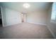 A spacious bedroom featuring new carpet and large double door closet at 105 E North Branch Rd, Ruskin, FL 33570