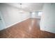 Bright dining room featuring wood floors, a modern chandelier, and neutral paint at 105 E North Branch Rd, Ruskin, FL 33570