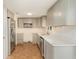Updated kitchen with gray cabinets, stainless steel appliances, and light countertops at 105 E North Branch Rd, Ruskin, FL 33570