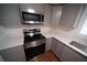 Updated kitchen with stainless steel appliances and light countertops at 105 E North Branch Rd, Ruskin, FL 33570