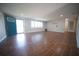 Open living room with wood-look tile, a bright blue front door, and recessed lighting at 105 E North Branch Rd, Ruskin, FL 33570