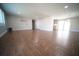 Spacious living room with wood look tile flooring and updated lighting at 105 E North Branch Rd, Ruskin, FL 33570
