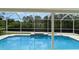 Enjoy waterfront views from this lovely screened-in swimming pool at 105 E North Branch Rd, Ruskin, FL 33570