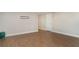 Bright room featuring hard flooring, neutral walls, and a white door; ready for your personal touch at 105 E North Branch Rd, Ruskin, FL 33570
