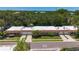 Scenic aerial shot of a community with mature trees, and beautifully landscaped yards at 1102 Cara Dr, Largo, FL 33771
