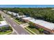 Aerial view capturing a community featuring lush landscaping, well-maintained homes, and a serene atmosphere at 1102 Cara Dr, Largo, FL 33771