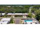 An aerial view of the community highlighting a swimming pool and well-maintained landscaping at 1102 Cara Dr, Largo, FL 33771