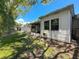 Exterior view of the home showcasing the patio and backyard at 1102 Cara Dr, Largo, FL 33771