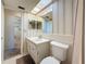 Bathroom featuring a vanity, toilet, mirror, and a door to another room at 1102 Cara Dr, Largo, FL 33771