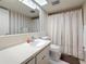 Bathroom featuring a vanity, toilet, mirror, and a bathtub with shower curtain at 1102 Cara Dr, Largo, FL 33771