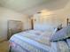 Bedroom showcasing a bed with decorative pillows, and a closet with louvered doors at 1102 Cara Dr, Largo, FL 33771