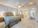 Spacious bedroom with neutral carpet, and a full ensuite bathroom at 1102 Cara Dr, Largo, FL 33771