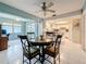 Bright dining area and kitchen with white tile flooring and plenty of natural light at 1102 Cara Dr, Largo, FL 33771