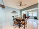Cozy dining area with a round table and decorative wall art at 1102 Cara Dr, Largo, FL 33771