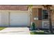 Well-maintained home featuring stone accents, attached garage, and inviting curb appeal at 1102 Cara Dr, Largo, FL 33771